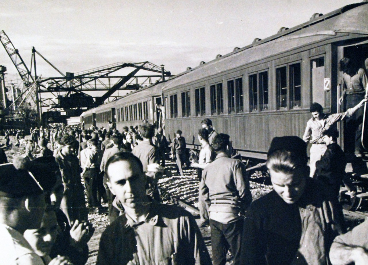 <p>19-LCM-NorthAfrica-2: Naval Battle of Casablanca, November 8-16, 1942. Casablanca, French Morocco. Survivors of the three torpedoed U.S. transports arrive by train at Casablanca harbor from Fedala, a French town about 15 miles north. It was the first ride in a French train for many of the Americans, who were transported in first and second class coaches rather than the “forty and eight” variety of the World War I days, 3 December 1942.&nbsp;</p>
