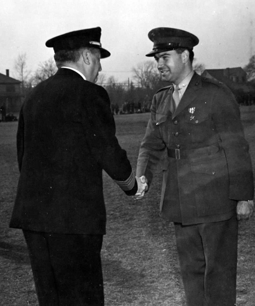 <p>80-G-37465: Operation Torch, November 1942. Silver Star presentation to Major F. M. Rogers, USMC, by Vice Admiral Henry K. Hewitt for gallantry in Operation Torch, North African Invasion, November 1942. Photograph dated, 22 February 1943.</p>
