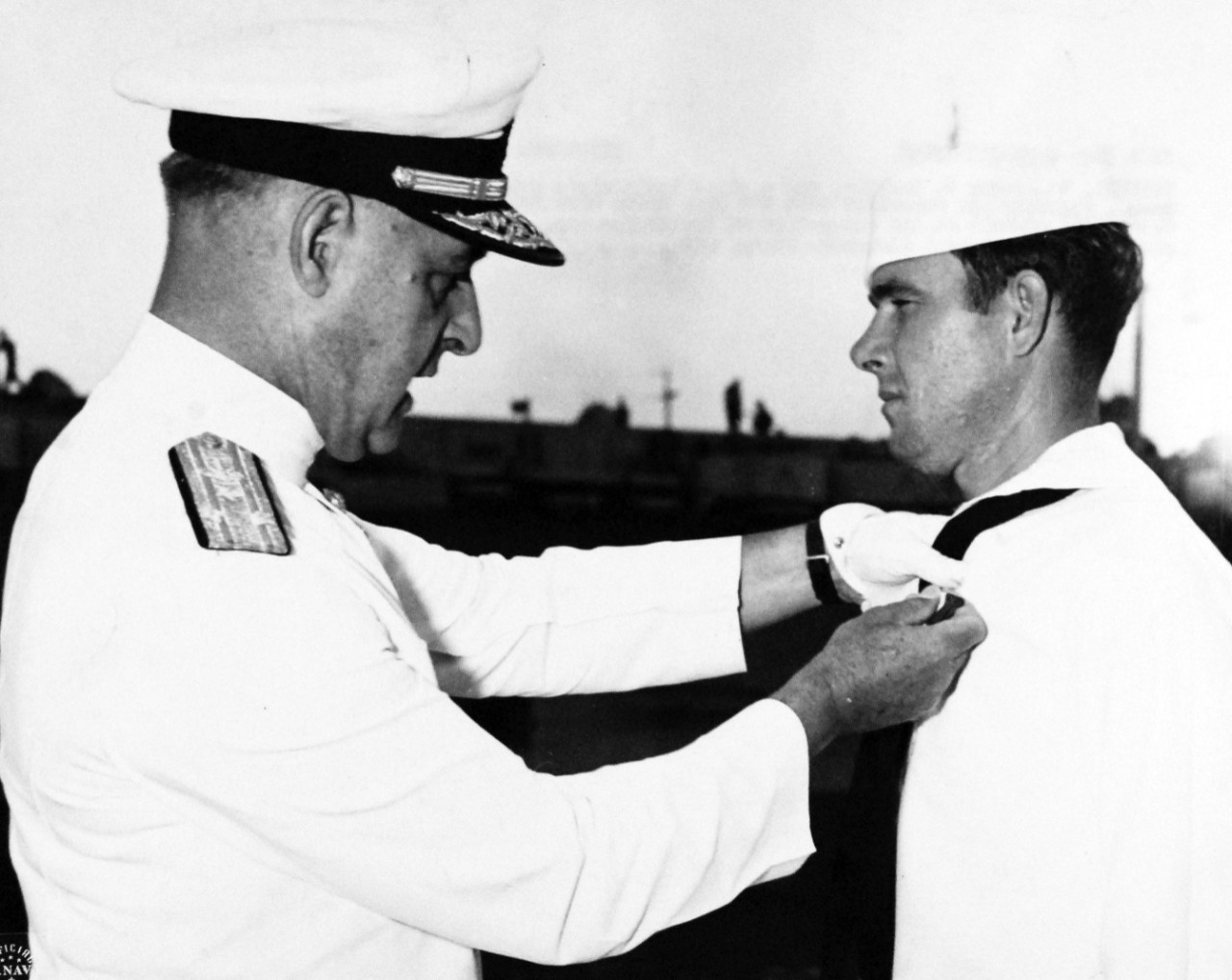 80-G-42771:  Boatswain’s Mate  First Class Roy B. Dowling, USN, Navy Cross.    Naval Operating Base, Norfolk, Virginia, Roy B. Dowling, now a Chief Boatswain’s Mate, USNR, is decorated with the Navy Cross for his actions in the assault on and occupation of French Morocco.  The decoration is pinned on him by Vice Admiral Alexander Sharp, USN, Commander, Service Force, U.S. Atlantic Force.    Released August 21, 1943.  Official U.S. Navy Photograph, now in the collections of the National Archives.   (2017/08/01).  