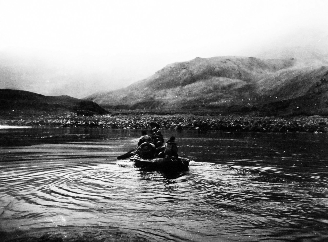 80-G-55656:  Aleutian Islands Campaign, June 1942 - August 1943.   Landing operations on Lilly Beach, Kiska, Aleutian Islands.  Men are transferred from barge to rubber boat, August 15, 1943.  Photographed  by CPU-4. Official U.S. Navy photograph, now in the collections of the National Archives.   (2015/4/28)
