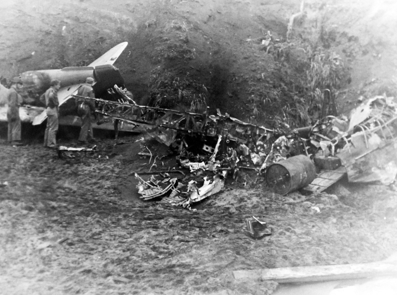 LC-Lot-803-24:  Aleutian Islands Campaign, June 1942 - August 1943.   Allied Invasion of Kiska, August 15-24, August 1943.   Landing forces view Mitsubishi A6M “Zero” remains.  Members of the joint American-Canadian landing forces which took Kiska Island in the Aleutians look over the wreckage of a Japanese Zero on August 16th.  Photographed through Mylar sleeve.  Courtesy of the Library of Congress.   (2015/11/06).
