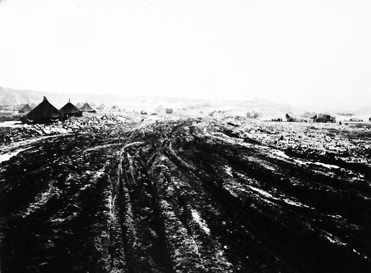 80-G-41885:   Aleutian Islands Campaign, June 1942 - August 1943.  Battle of Attu, May 11-29, 1943.    Mud and ruts, but the working-fighting Seabees soon whip this stuff into roads, camp areas and landing strips.  Photograph released June 21, 1943.  U.S. Navy Photograph, now in the collections of the National Archives.  (2016/05/10).