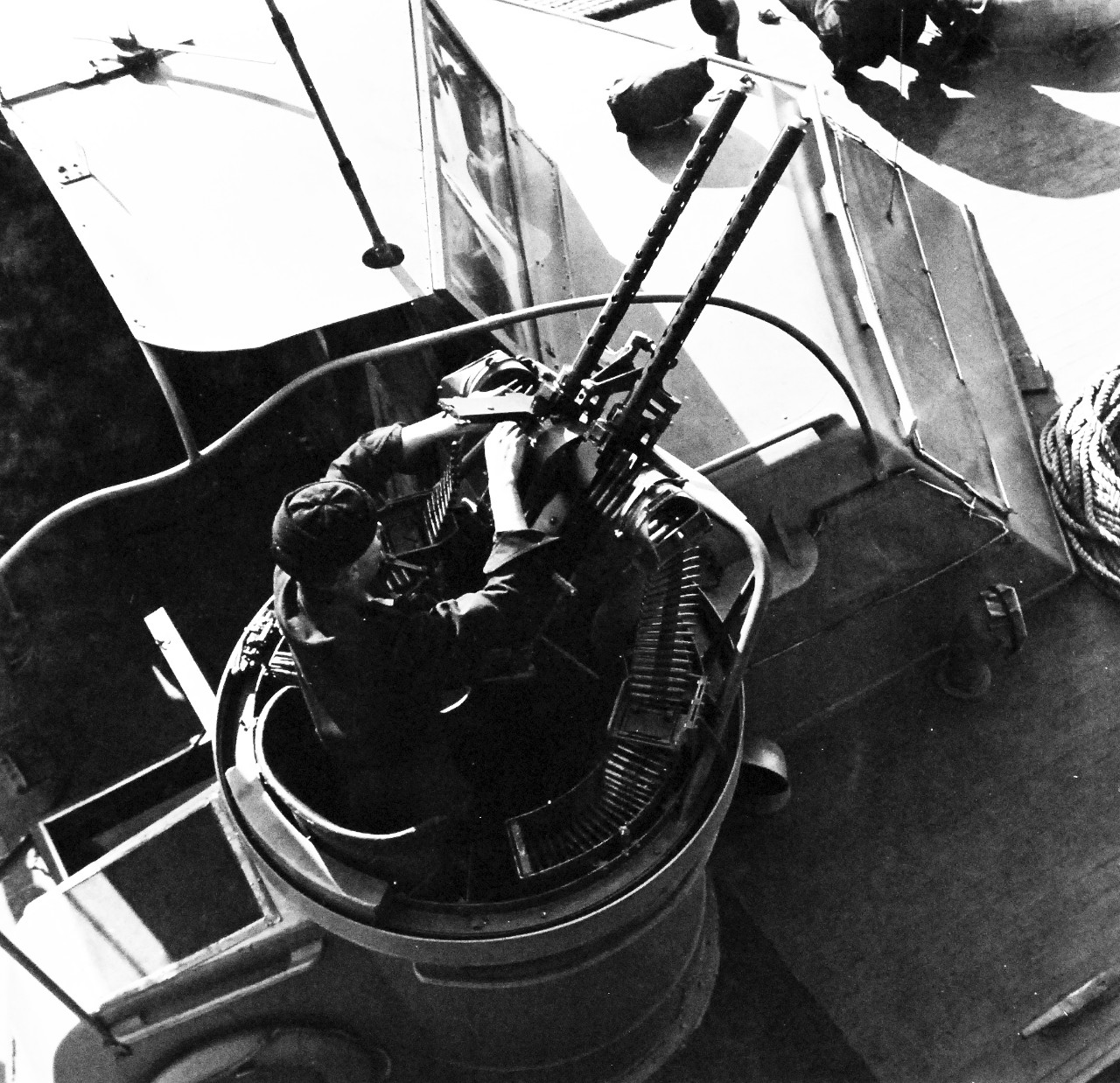 80-G-475658:  Aleutian Islands Campaign, June 1942 - August 1943.  Battle of Attu, May 11-29, 1943.  Gunner cleans 50 mm  gun aboard PT Boat at Attu base.   Photographed released by the Steichen Photographic Unit:  Lieutenant Commander Horace Bristol, July 1943.   TR-5334.    U.S. Navy photograph, now in the collections of the National Archives.  (2015/11/17).