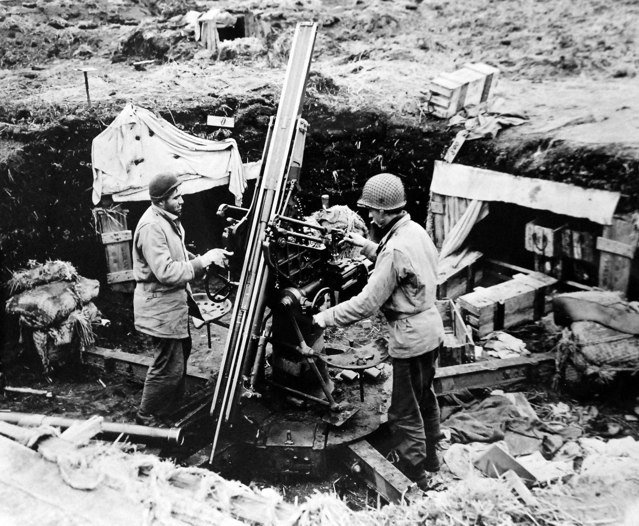 LC-Lot-803-33:  Aleutian Islands Campaign, June 1942 - August 1943.   Allied Landing on Attu Island, May 11 1943. This One Won’t Point At U.S. Planes Again.  Americans examine a Japanese anti-aircraft gun on a hill at head of west arm of Holtz Bay.  This was one of the strong Japanese positions from which Americans drove their troops.  Barrel of gun is on ground, left foreground, May 19, 1943.  U.S. Navy photograph, released May 29, 1943.   Photographed through Mylar sleeve.  Courtesy of the Library of Congress.  (2015/11/06).