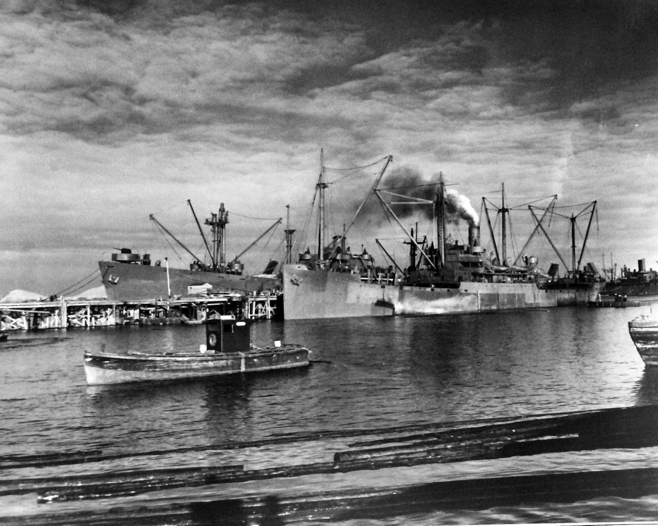 80-G-210043:    Sweepers Cove, Adak, Alaska, November 1943.    Ships at Navy Dock, Sweepers Cove, Adak, Alaska, 30 November 1943.  Official U.S. Navy Photograph, now in the collections of the National Archives.  (2013/ 9/19).  