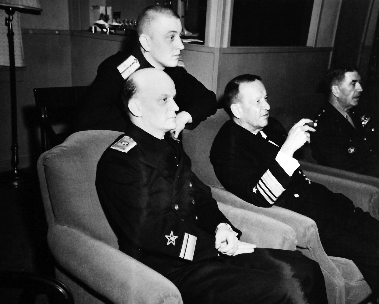 80-G-342180:  Naval Operating Base, Adak, Alaska, July 1945.   Soviet Rear Admiral Popov, Red Army visits Adak, Alaska.  Party at Rear Admiral R.A. Wood’s quarters, 6 July 1945.  Left to right:  Rear Admiral Popov, Captain Krivoshekov (interpreter); Vice Admiral Frank J. Fletcher, USN; and Major General Brooks, USA.  Official U.S. Navy Photograph, now in the collections of the National Archives.  (2013/08/21).  