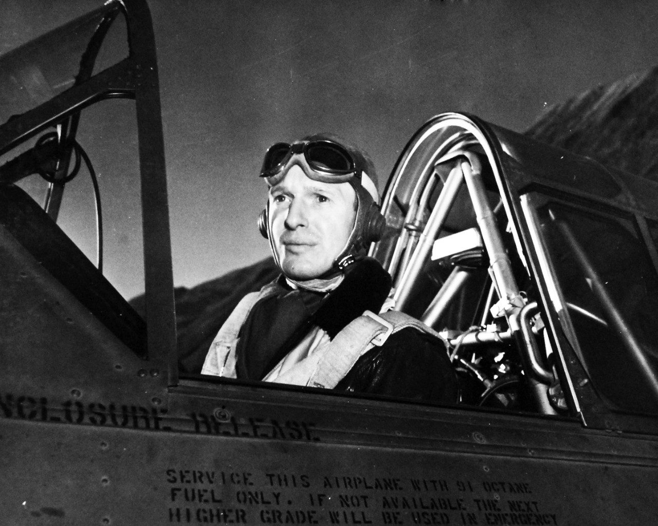 80-G-279776:   U.S. Naval Air Station, Kodiak, Alaska, 1943.     Commander George P. Rice, Chief Staff Officer in cockpit of an SNJ.  Photograph released November 15, 1943. U.S. Navy Photograph now in the collections of the National Archives.  (2016/01/19).