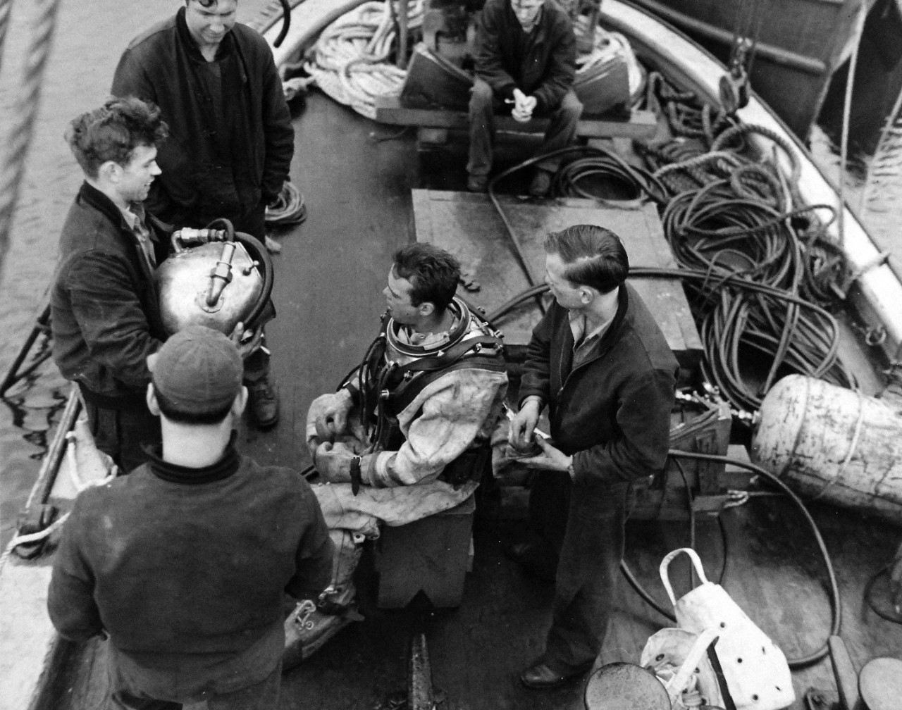 80-G-279823:   Montague Island, Gulf of Alaska, Alaska, 1945.   Salvage diver onboard ship.   Photographed by PhoM3/R.L. Willey, May 30, 1945.  U.S. Navy Photograph now in the collections of the National Archives.  (2016/01/19).