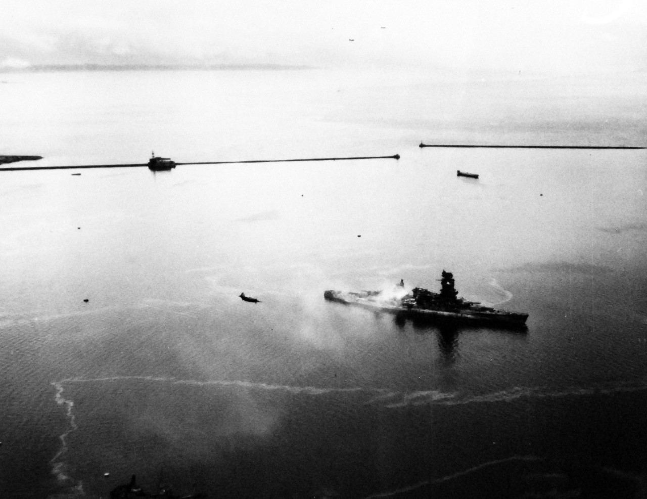 80-G-343772:  Japanese battleship Nagato, 1945.     The badly damaged Japanese battleship Nagato off Yokosuka Naval Air Station, Japan, as seen from plane of USS Shangri La (CV-38).    Photographed by Photographer’s Mate Second Class J. Guttoach, August 26, 1945.  Official U.S. Navy Photograph, now in the collections of the U.S. National Archives.   (2014/5/22). 