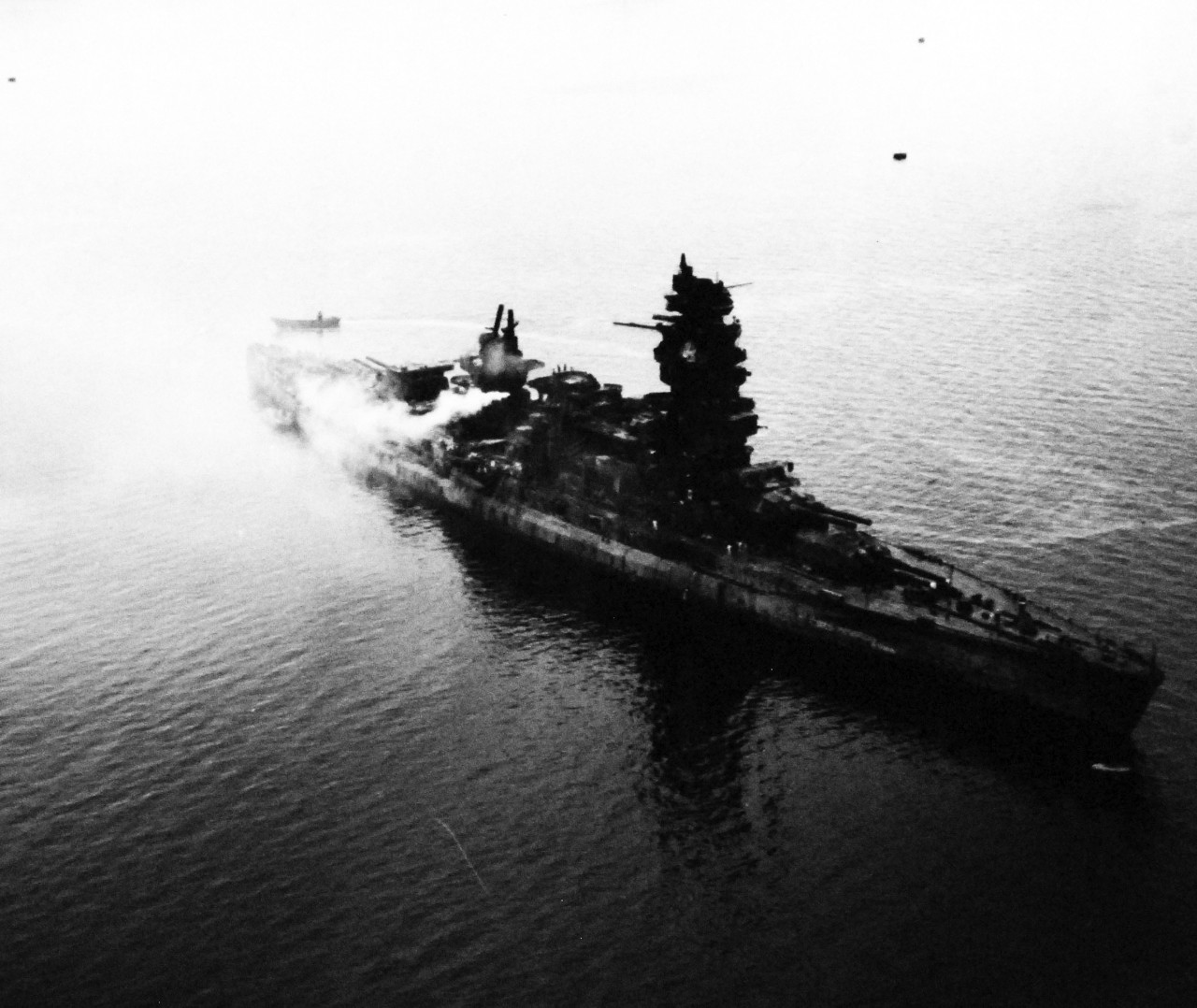 80-G-343774:   Japanese battleship Nagato, 1945.      The badly damaged Japanese battleship Nagato off Yokosuka Naval Air Station, Japan, as seen from plane of USS Shangri La (CV-38).    Photographed by Photographer’s Mate Second Class J. Guttoach, August 26, 1945.   Official U.S. Navy Photograph, now in the collections of the U.S. National Archives.   (2014/5/22). 