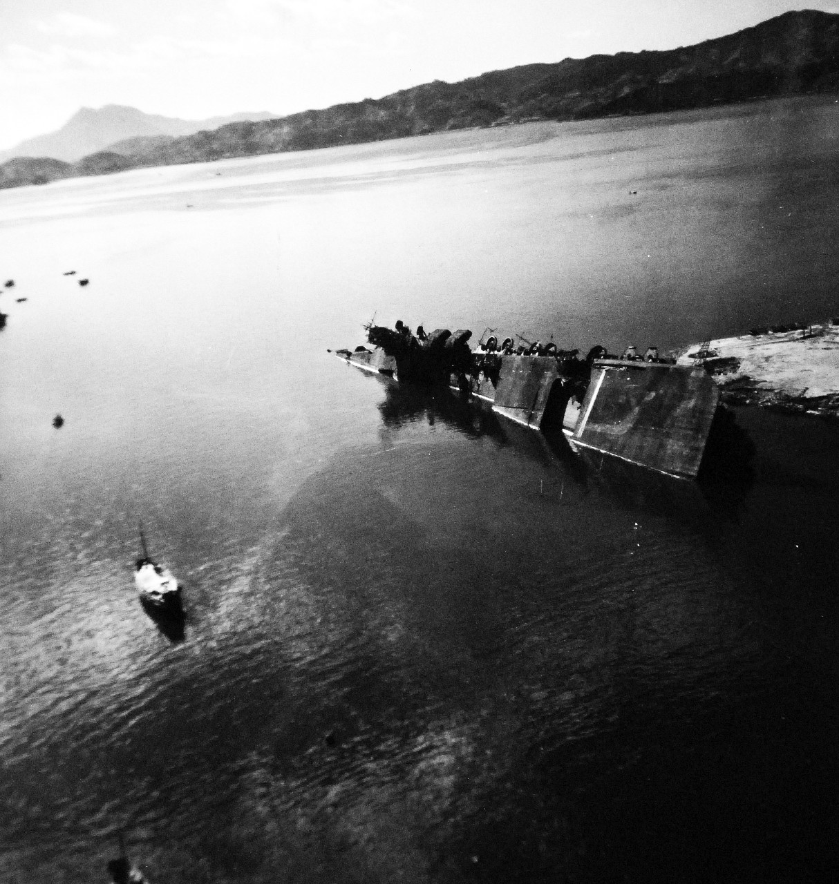 80-G-349906:  Japanese aircraft carrier Amagi, 1945.  Damaged Japanese ships in Kure Harbor, Japan.  Shown is Japanese aircraft carrier Amagi.   Photographedby USS St. George (AV-16) aircraft,  October 14, 1945.    Official U.S. Navy Photograph, now in the collections of the National Archives.   (2014/6/19). 