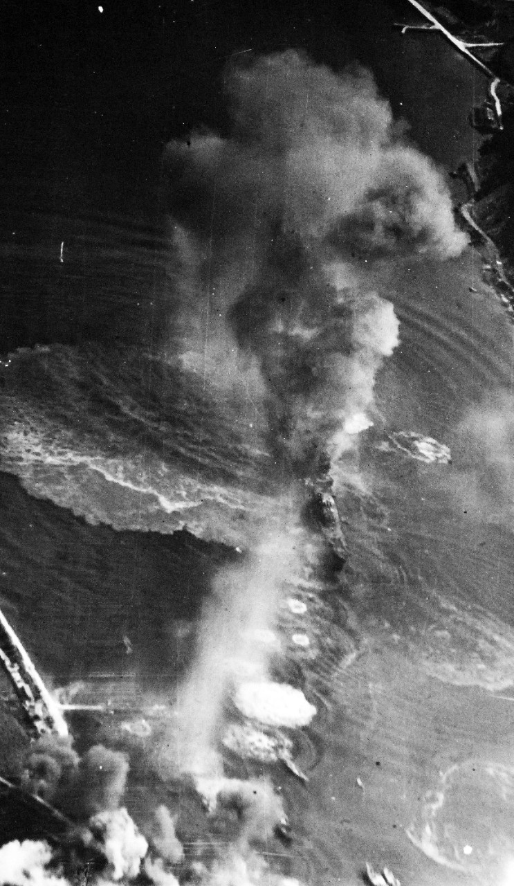 80-G-490225:  Raids on Japanese Home Islands, July 1945.  Japanese cruiser Oyoda under attack by American and British carrier planes in Kure Bay, Japan, July 28, 1945.  U.S. Navy Photograph, now in the collections of the National Archives. (2015/12/08).