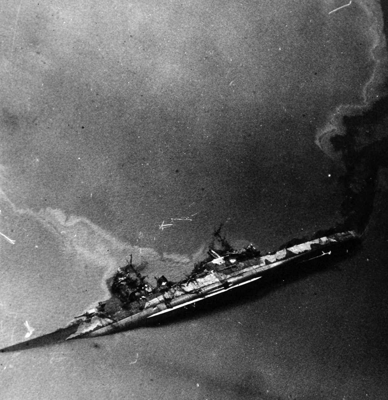 80-G-490228:  Raids on Japanese Home Islands, July 28, 1945.  Japanese cruiser Oyoda after attack by American and British carrier planes in Kure Bay, Japan, July 28, 1945.  U.S. Navy Photograph, now in the collections of the National Archives. (2015/12/08).