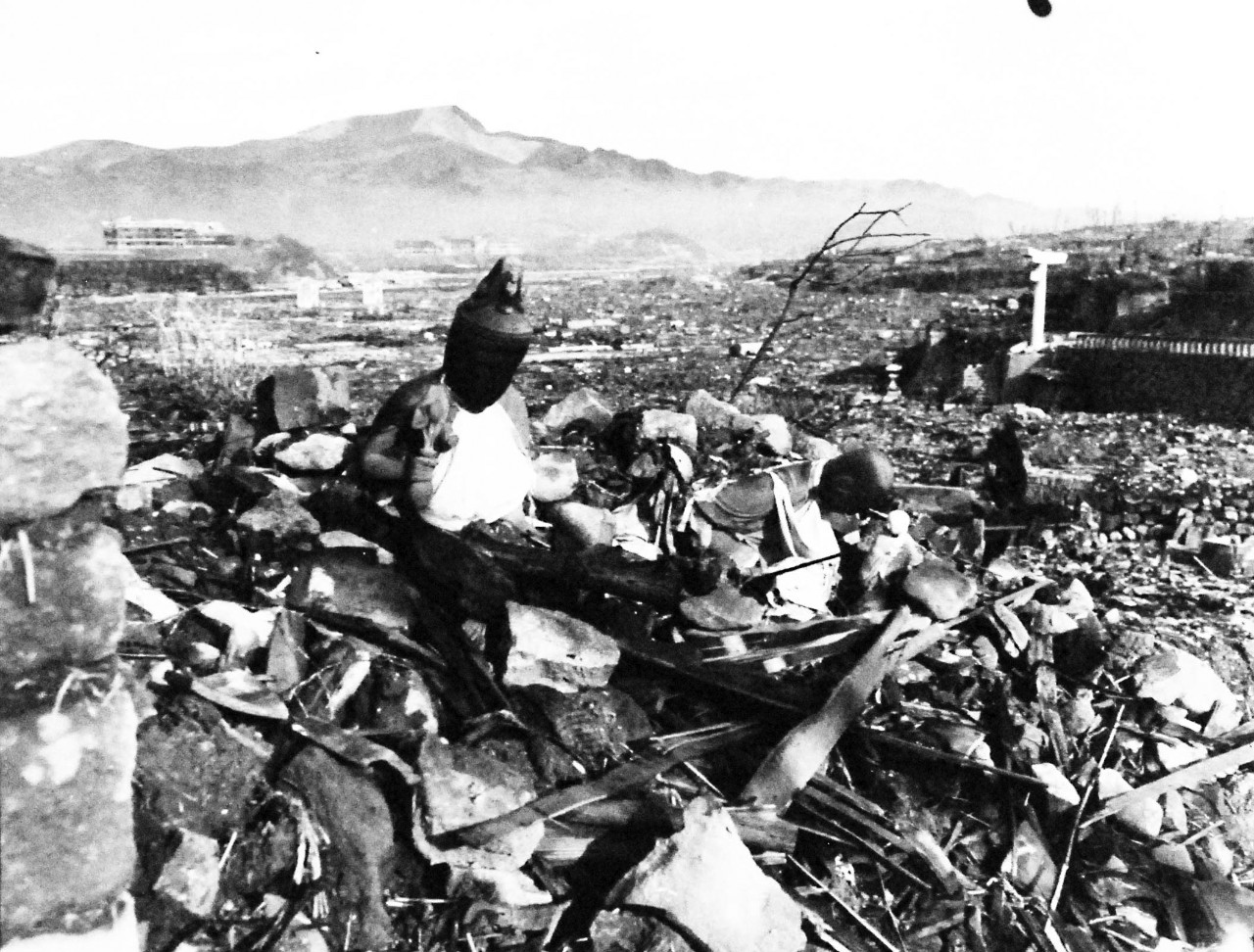 127-GW-1643-137016:     Nagasaki, Japan, 1945.   Battered religious figures stand watch on a hill above a tattered valley.      Photographed by September 24, 1945.        Official U.S. Marine Corps Photograph, now in the collections of the National Archives.  (2016/10/25).
