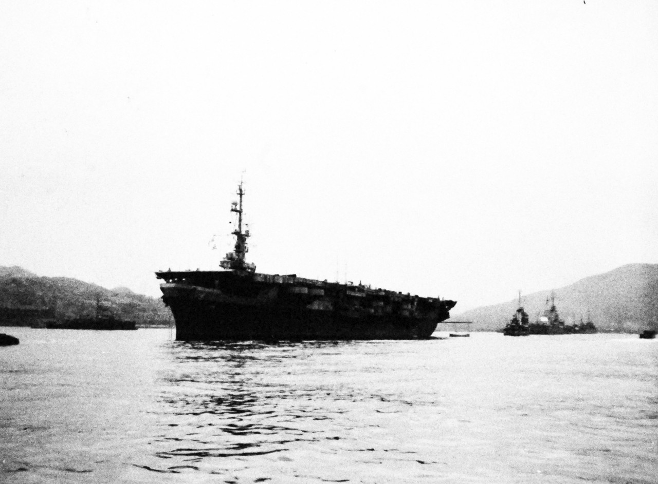 127-GW-1643-138641:     Nagasaki, Japan, 1945.   USS Cape Gloucester (CVE-109) anchored in mid-stream at Nagasaki, waiting to take aboard liberated Allied prisoners of war.    Photographed by Private First Class L.F. DeRycke, September 5, 1945.        Official U.S. Marine Corps Photograph, now in the collections of the National Archives.  (2016/10/25).