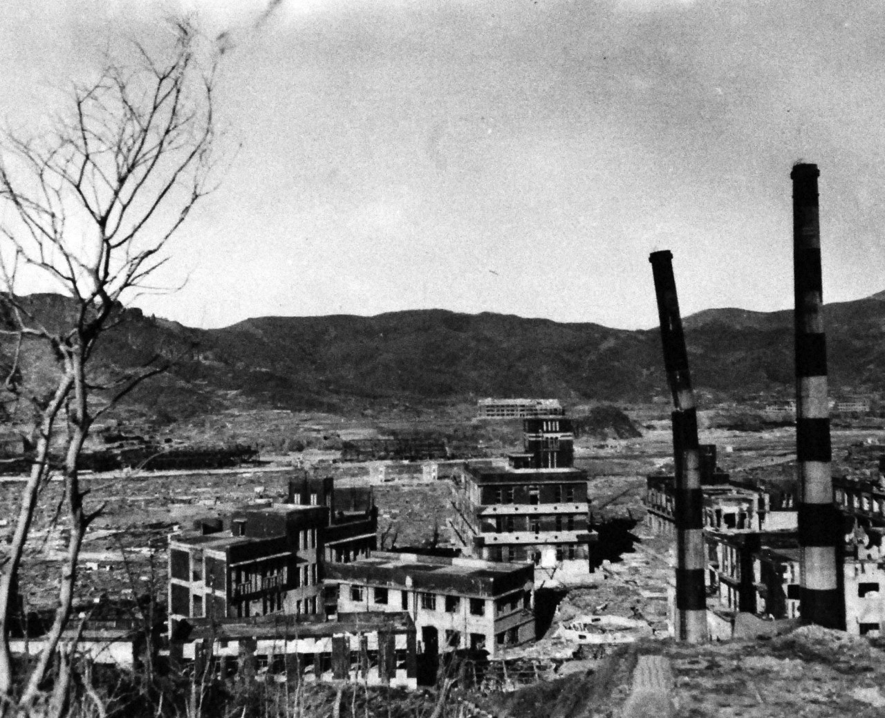 127-GW-1643-147932:   Nagasaki, Japan, 1945.     Taken outside of Medicine College and hospital to show size of building.  Photographed at Nagasaki, Japan, October 25, 1945.        Official U.S. Marine Corps Photograph, now in the collections of the National Archives.  (2016/10/25).