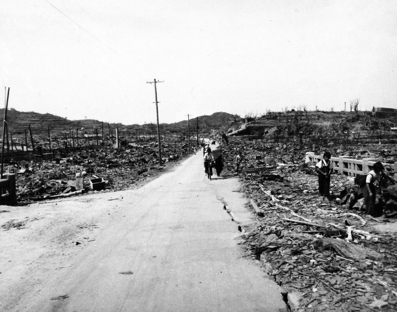 80-G-264910:   Nagasaki, Japan, 1945.   View of the bomb damage from August 9, 1945.  Altitude of 300’.  Photographed by USS Chenango (CVE-28) aircraft on October 15, 1945.  Official U.S. Navy photograph, now in the collections of the National Archives.   (2015/12/01).