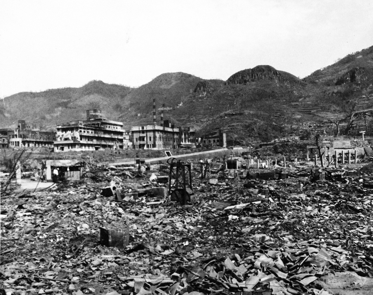 80-G-264911:   Nagasaki, Japan, 1945.   View of the bomb damage from August 9, 1945.  Altitude of 300’.  Photographed by USS Chenango (CVE-28) aircraft on October 15, 1945.  Official U.S. Navy photograph, now in the collections of the National Archives.   (2015/12/01).