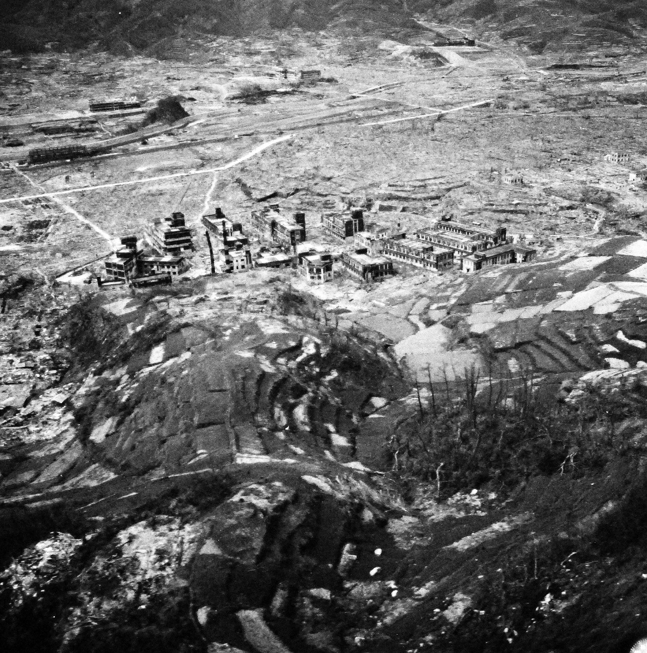 80-G-264929:   Nagasaki, Japan, 1945.    Aerial view of the bomb damage from August 9, 1945.  Altitude of 300’.  Photographed by USS Chenango (CVE 28) aircraft on October 15, 1945.  .   Official U.S. Navy photograph, now in the collections of the National Archives.   (2015/12/01).