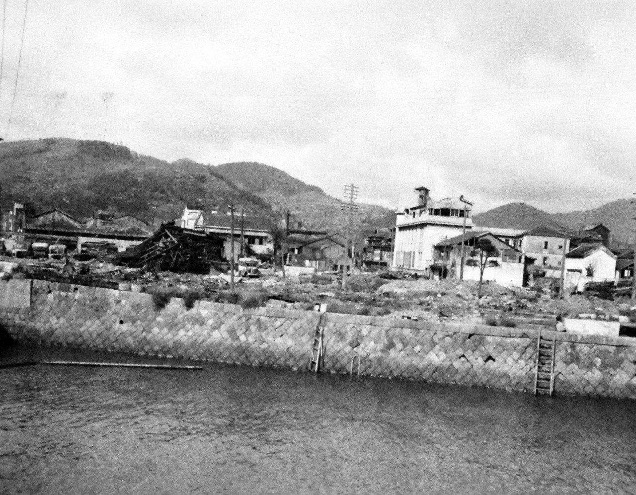80-G-346553:  Nagasaki, Japan, 1945.   Atomic bomb damage to building at Nagasaki, Japan.  Photographed by crew of USS Chenango (CVE-28), September 13, 1945.    Official U.S. Navy photograph, now in the collections of the National Archives.   (2014/11/5).