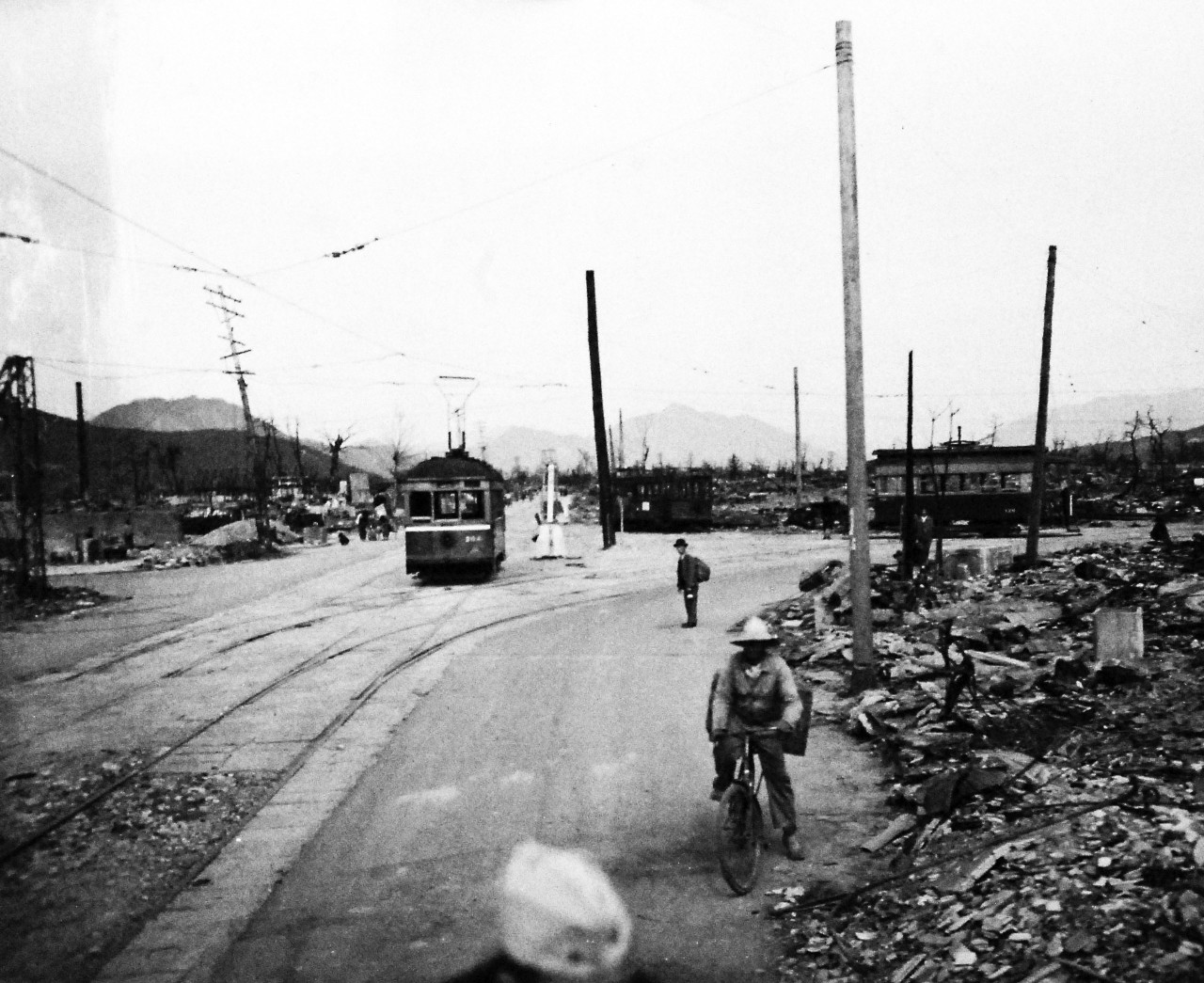 80-G-354617:  Hiroshima, Japan, 1945.   Atomic Bomb Damage to Hiroshima, as seen by USS Appalachian (AGC-1).   Trolley. Photographed by PhoM3/C George Almarez.  Photographed received October 26, 1945.   U.S. Navy photograph, now in the collections of the National Archives.  (2016/06/21).