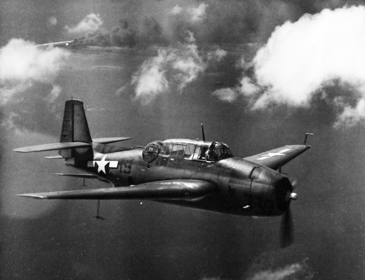 80-G-204725:  Operation Galvanic, November 1943.     TBF aircraft from USS Coral Sea (CV-43) on patrol over Makin Island in the Gilbert Group, 20 November 1943.    Official U.S. Navy Photograph, now in the collections of the National Archives.  (2013/09/19).
