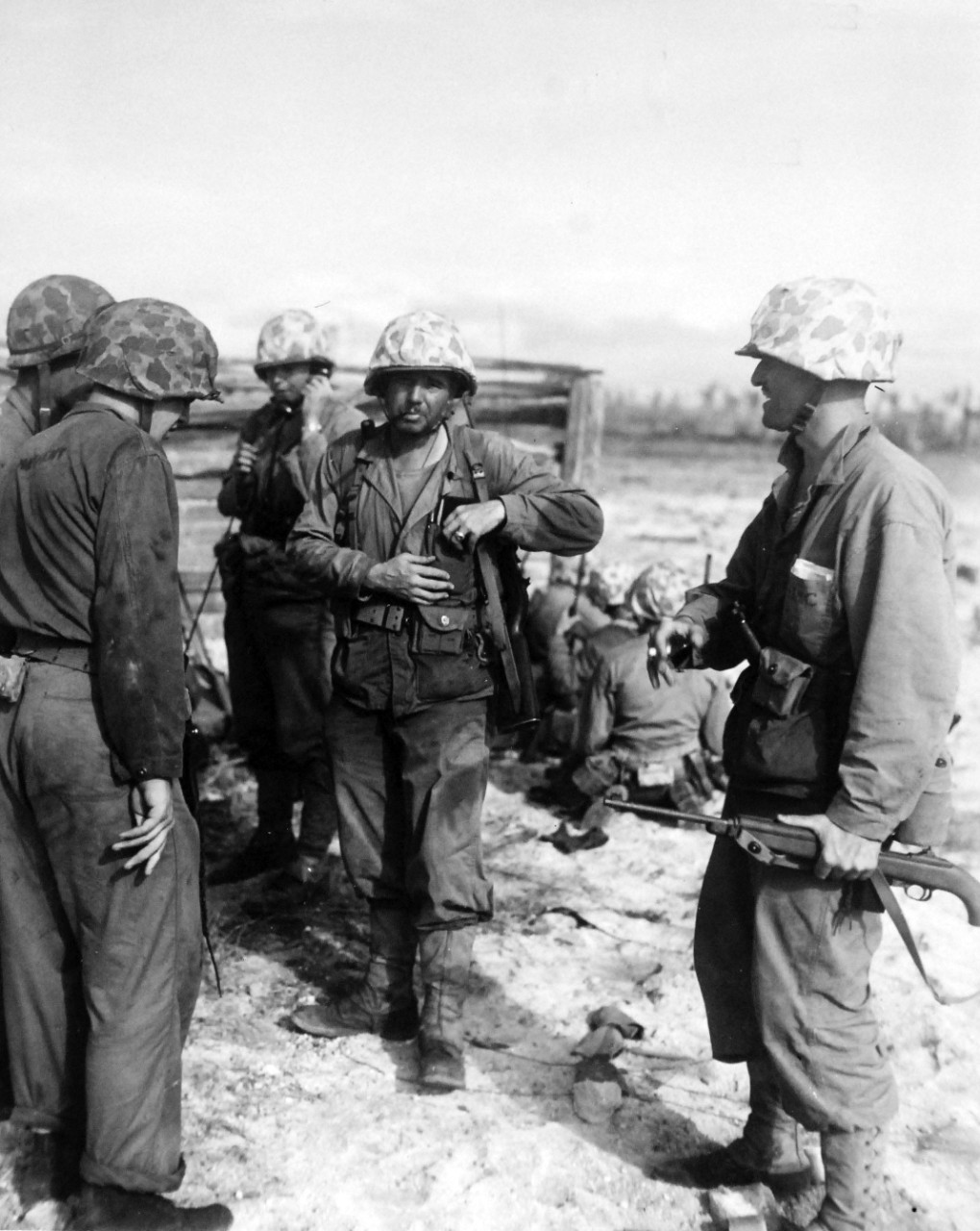 80-G-208973:  Operation Flintlock, January-February 1944.   Fourth Marine Division attack on Roi Island, Kwajalein Atoll, Marshall Islands, February 1-2, 1944.   Shown:  Colonel Edward J. Dillion directing mopping-up operations.  To right is First Lieutenant Godfrey F. Zimmerman, Air Liaison Officer.   Official U.S. Navy photograph, now in the collections of the National Archives.  (2017/07/25).  