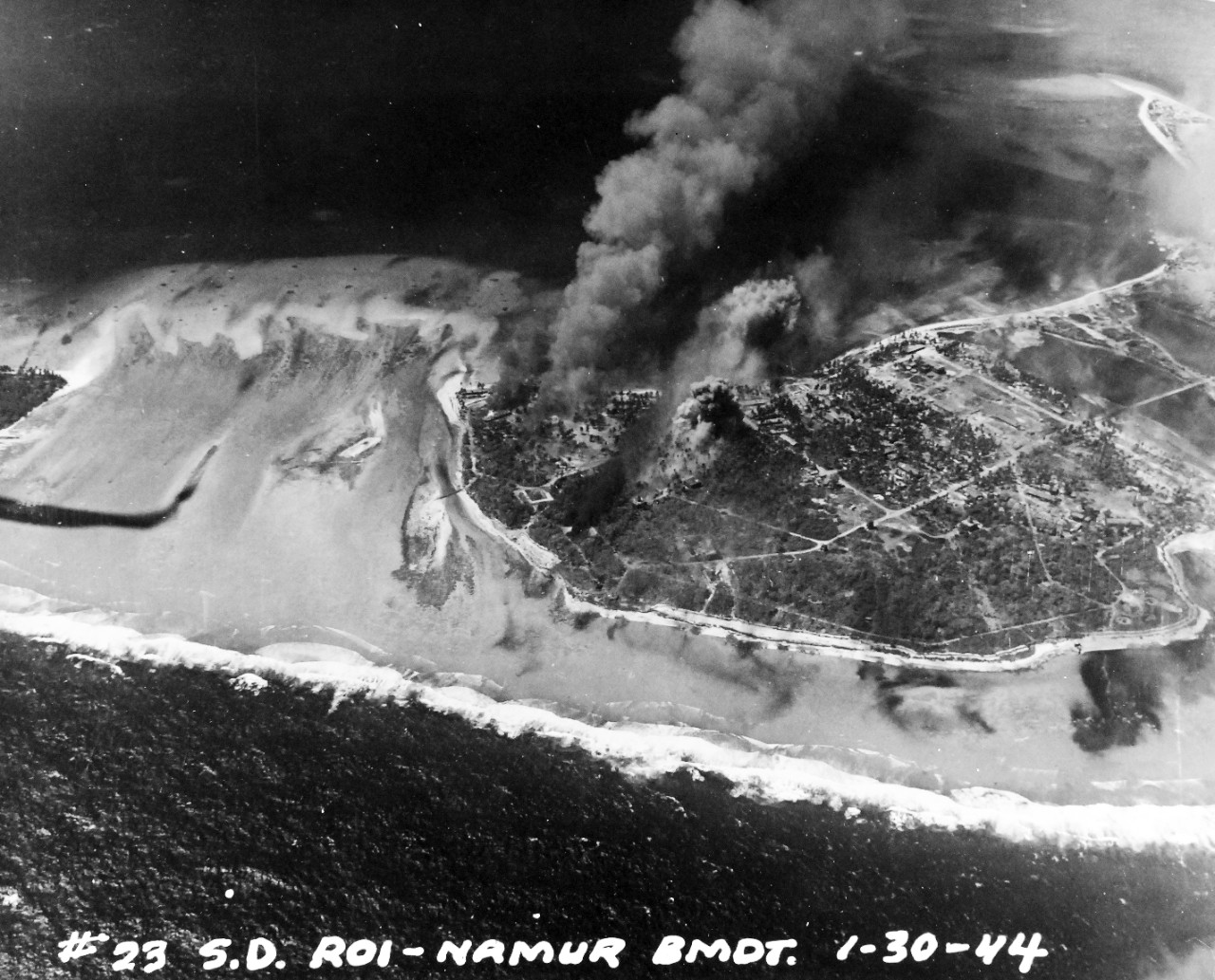 80-G-227901:  Pre-Raid Bombardent of Kwalajein, January 30, 1944.   Roi and Namur Island, Marshall Islands.   Bombardment preceding the invasion on the following day.   Photographed by plane from USS South Dakota (BB-57).    Official U.S. Navy Photograph, now in the collections of the National Archives.   (2018/02/28).  