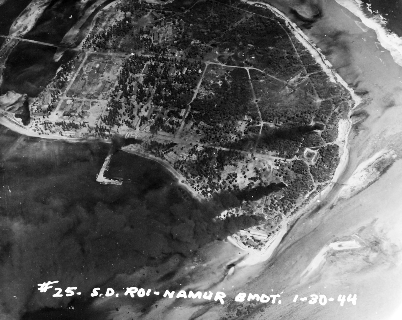 80-G-227903:  Pre-Raid Bombardent of Kwalajein, January 30, 1944.  Roi and Namur Island, Marshall Islands.   Bombardment preceding the invasion on the following day.   Photographed by plane from USS South Dakota (BB-57).    Official U.S. Navy Photograph, now in the collections of the National Archives.   (2018/02/28).  