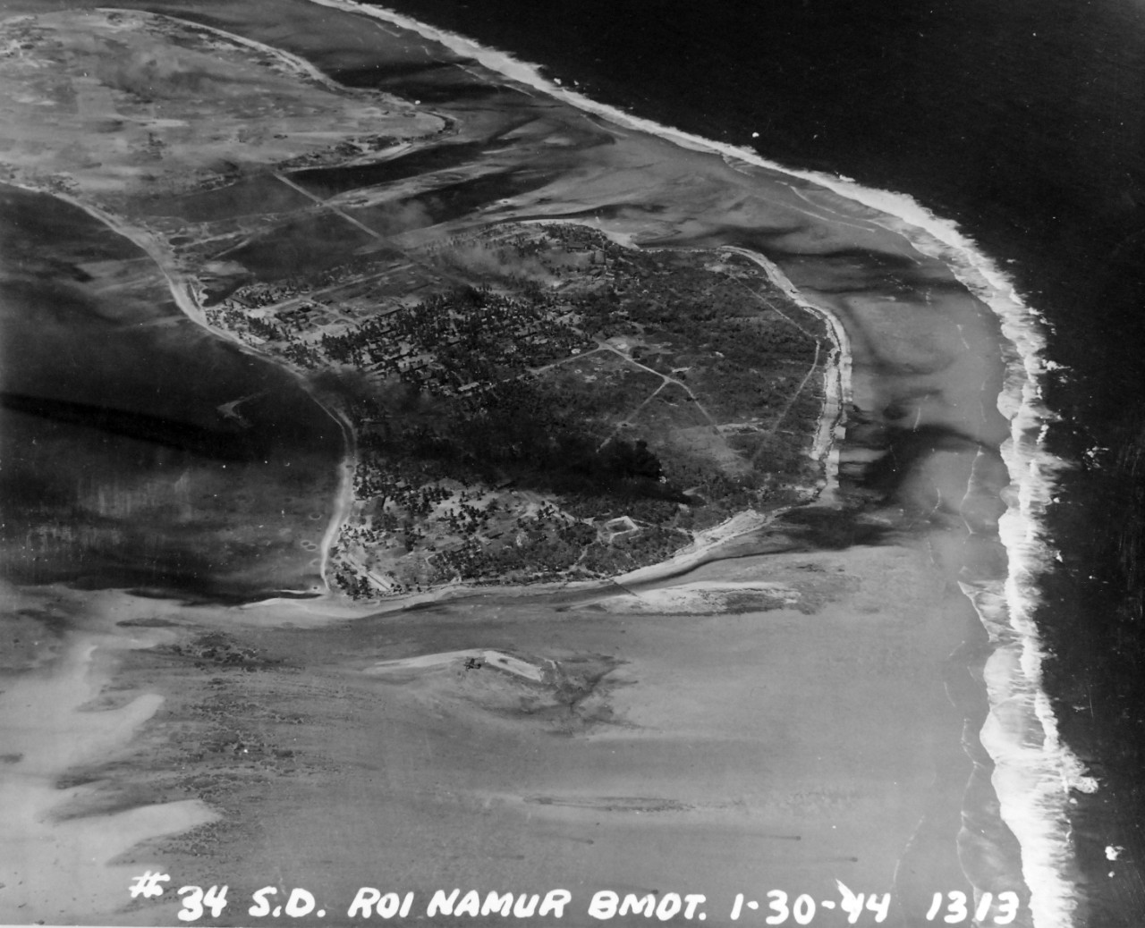 80-G-227912:  Pre-Raid Bombardent of Kwalajein, January 30, 1944..   Roi and Namur Island, Marshall Islands.   Bombardment preceding the invasion on the following day.   Photographed by plane from USS South Dakota (BB-57).    Official U.S. Navy Photograph, now in the collections of the National Archives.   (2018/02/28).  