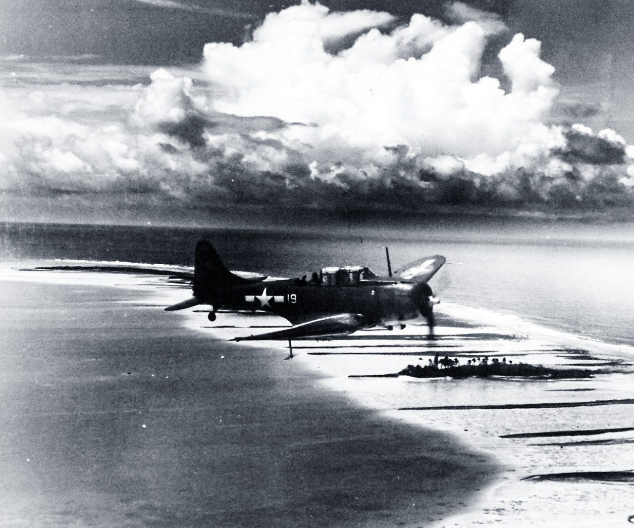 80-G-234786:  SBD-5 over Majuro Atoll, 1944.   Aircraft was from USS Lexington (CV-16).    Photograph released May 13, 1944.    Official U.S. Navy photograph, now in the collections of the National Archives.  (2016/11/15).