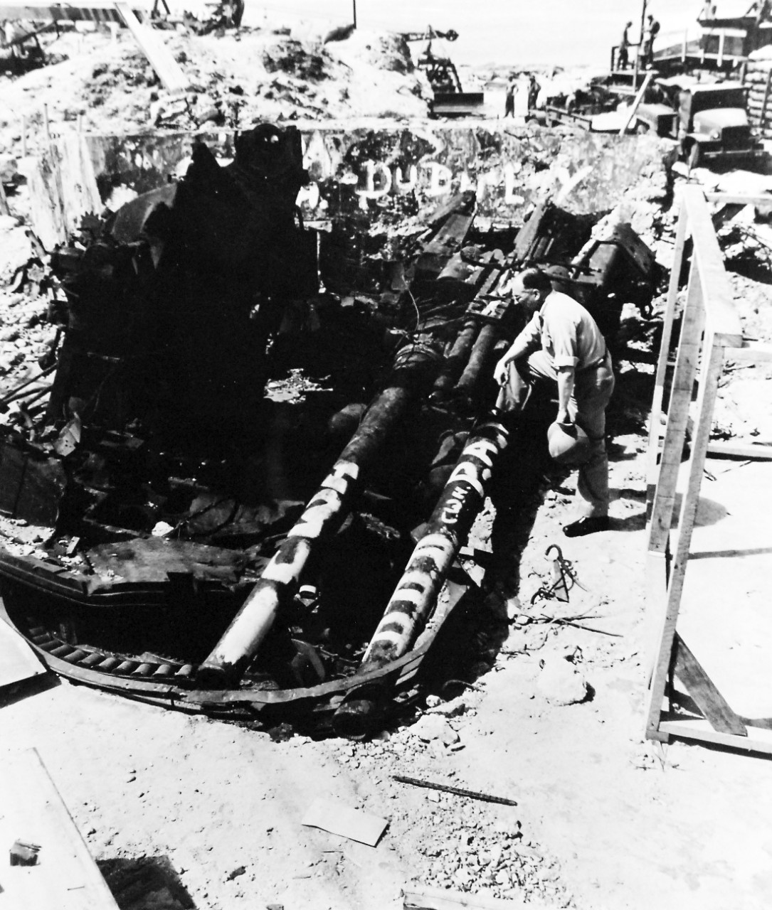 80-G-46525:   Operation Flintlock, February 1944.  Captured Japanese twin gun, Kwajalein Island, Kwajalein Atoll, Marshall Islands, blasted off its mount by U.S. bombardment.  Released September 19, 1944.  Official U.S. Navy Photograph, now in the collections of the National Archives.  (2016/06/07).