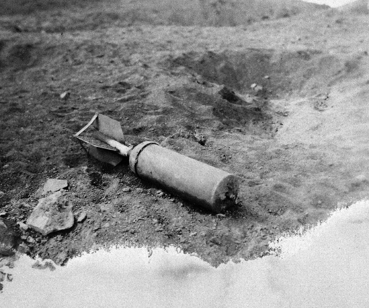 127-GW-304-139732:  Battle for Iwo Jima, February-March 1945.   Japanese rocket ten inches in diameter. Photographed Corporal T.G. Burgess, February 28, 1945.  U.S. Marine Corps photograph, now in the collections of the National Archives.  (2016/02/17). Note, photograph is damaged.  