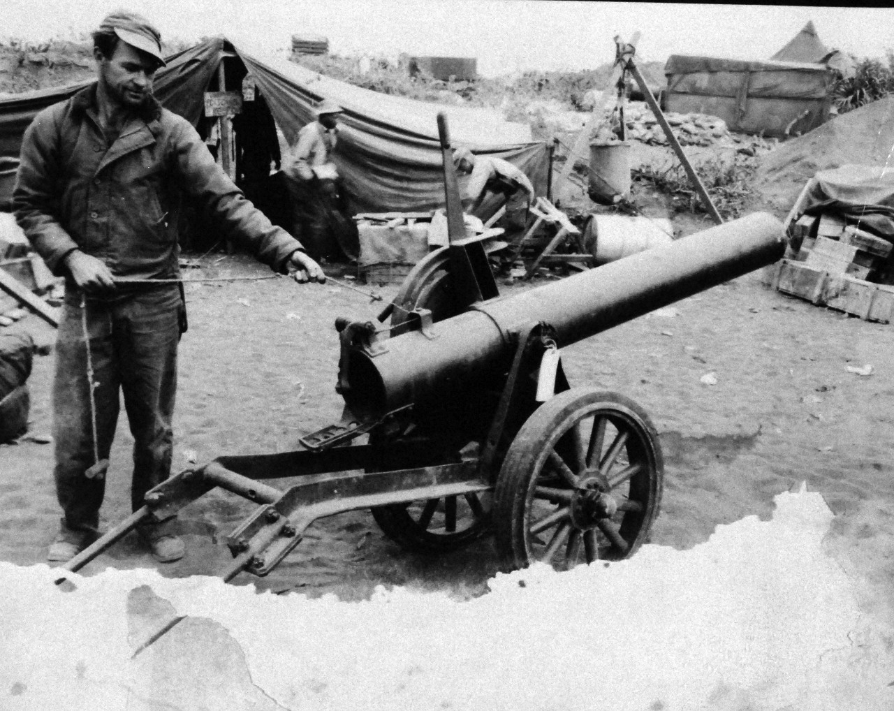 127-GW-304-143482:  Battle for Iwo Jima, February-March 1945.   ¾ view of Japanese 20cm mobile rocket launcher.  Breech leaded with firing pin in the firing position.  Photographed by Purser, March 1945.   Official U.S. Marine Corps photograph, now in the collections of the National Archives.  (2016/02/17). Note, photograph is damaged.