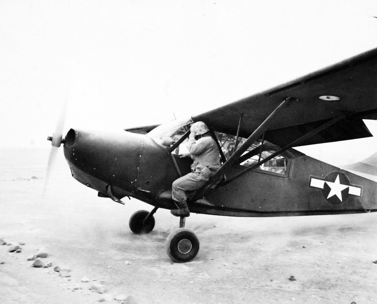 127-GW-298-111091:  Battle for Iwo Jima, February-March 1945.   The first Stinson OY-1 “Sentinel” plane piloted by Lieutenant H. Olson taxis down the strip to join his other buddy who flew with him to Iwo Jima.  Photographed by Dodds, February 26, 1945.  Official U.S. Marine Corps photograph, now in the collections of the National Archives.  (2016/02/17).