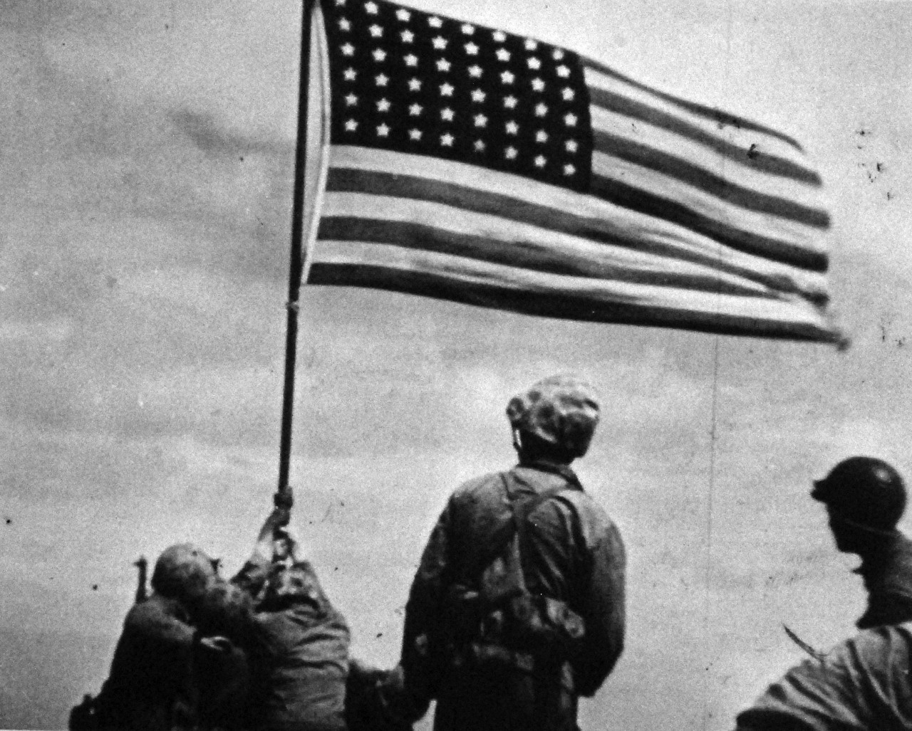 127-GW-319-146243: Iwo Jima Operations,  February 1945.  Iwo Jima Flag Raising on Mt. Suribachi.  Photographed by Dick, copied on October 3, 1946.     Official U.S. Marine Corps Photograph, now in the collections of the National Archives.  (2016/09/06).
