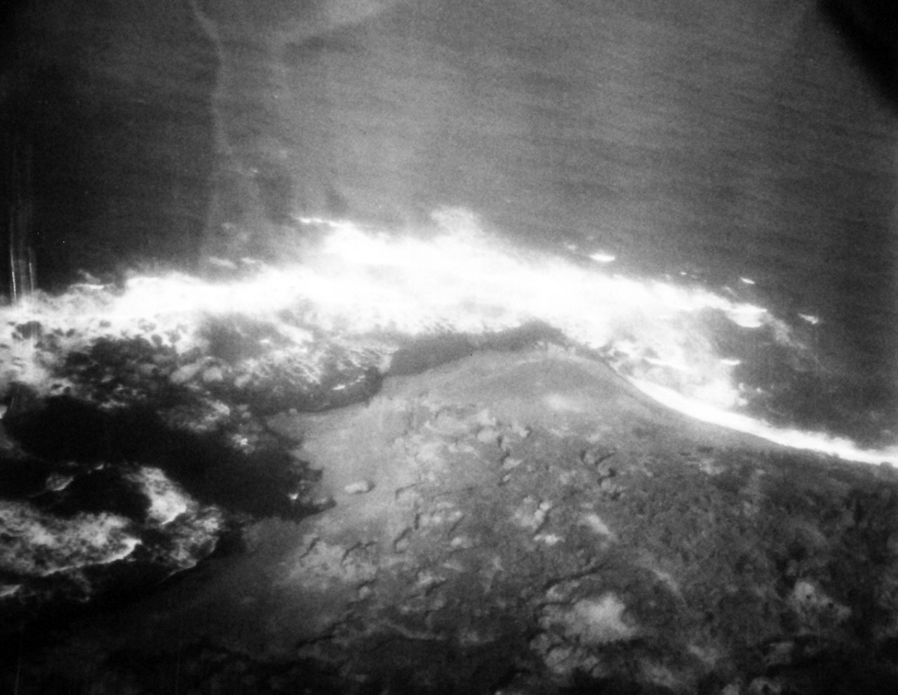 80-G-339199:  Battle for Iwo Jima, February-March 1945.  Bomb damage to Iwo Jima from Composite Squadron Ninety-Two (VC-92).  Image taken by Photographer’s Mate E.W. Peck from USS Tulagi (CVE-72).  Official U.S. Navy Photograph, now in the collections of the National Archives.  (2013/08/14).  