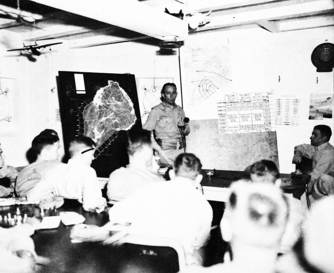 127-GW-302-142481:  Battle for Iwo Jima, February-March 1945.   Pre-invasion briefing, Colonel Edwin A. Pollock discussing landing phases of operation.  Photographed by Morejohn, 1945.  Official U.S. Marine Corps photograph, now in the collections of the National Archives.  (2016/02/17).
