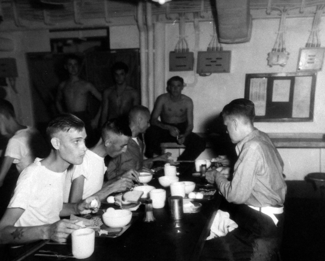 80-G-343552:    Allied Prisoner of War, Formosa, 1945.  Liberated British and Australian prisoners from a Formosan prison camp get their first real meal on board USS Block Island (CVE 106) after three years confinement in Formosan prison camps.   Photographed by Photographer’s Mate First Class T.K. Brett and Marine M. J. Kane (rank not given), September 5, 1945.   Official U.S. Navy photograph, now in the collection of the National Archives.  (5/22/2014).   