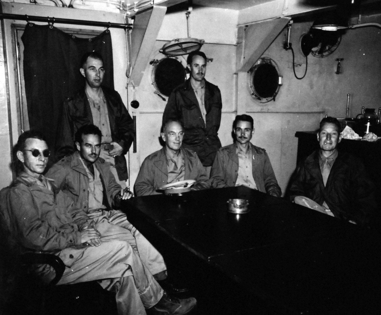 Allied Prisoners of War.  Marine officers who were held as prisoners of war onboard USS Monitor (LSV-5) at Yokohama, Japan.  The shown officers were captured at Peking, China, December 7, 1941.  Left to right:  Captain James F. Climie; Major Luther A. Brown; First Lieutenant Richard D. Weber; Colonel William W. Ashurst; First Lieutenant George R. Newton; Captain James R. Hester; and Chief Marine Gunner William A. Lee.  Photographed by CPHOM D.W. Wingfield and received September 23, 1945. Official U.S. Navy photograph, now in the collections of the National Archives.   (2015/11/24).