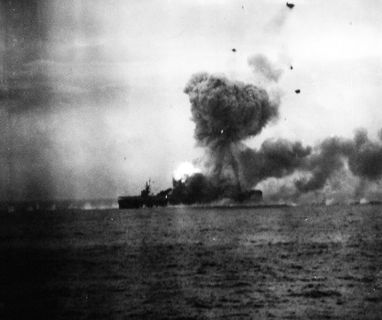 80-G-270513:   Battle off Samar, October 25, 1944.   USS St. Lo (CVE 63) burning after being hit by a Japanese suicide plane off Leyte Gulf, Philippines.  Taken from USS Kalinin Bay (CVE 68).   View shows the moments after the second explosion, 25 October 1944.  Official U.S. Navy Photograph, now in the collection of the National Archives.   (2014/05/15).  
