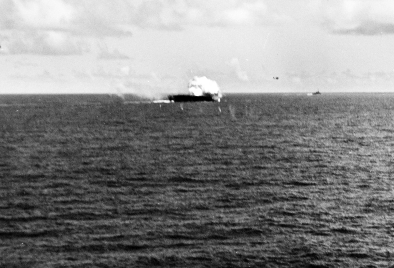 80-G-270614:   Battle off Samar, October 25, 1944.   Crash of Japanese “Zero” kamikaze on USS Suwanne (CVE 27) on the forward flight deck while off Samar on 26 October.  Note the F6F flying away from the explosion.   Photographed from USS Sangamon (CVE 26).   Official U.S. Navy Photograph, now in the collections of the National Archives.    (2014/4/24).  