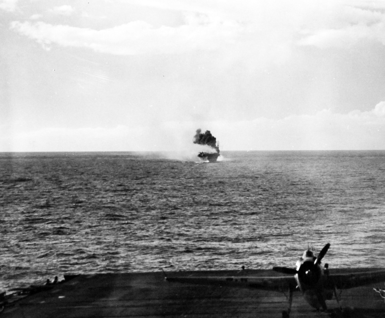 80-G-270626:  Battle off Samar, Japanese Kamikaze, October 25, 1944.     Fires and explosion on USS Suwannee (CVE-27) resulting from a suicide hit of a Japanese “Zero” near Leyte Gulf, Philippines, taken from USS Sangamon (CVE-25), 25 October 1944.  Official U.S. Navy Photograph, now in the collections of the National Archives.  (2014/4/24). 