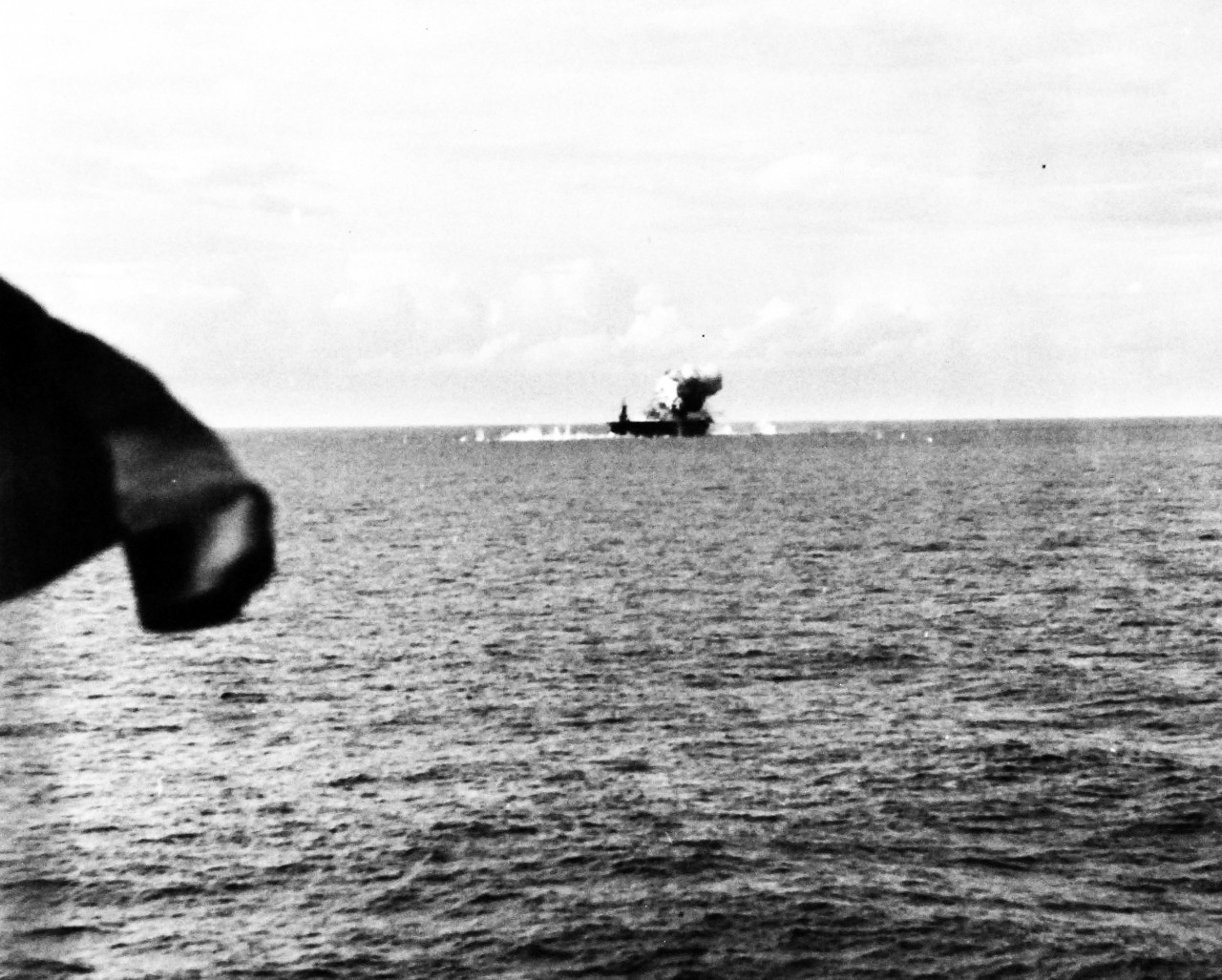 80-G-270667:  Battle off Samar, Japanese Kamikaze, October 25, 1944.   Japanese suicide plane attacking USS Santee (CVE-29), hitting after end of flight deck off Leyte Gulf, Philippines, as seen from USS Suwannee (CVE-27), 25 October 1944.  Official U.S. Navy Photograph, now in the collections of the National Archives.   (2014/4/24). 