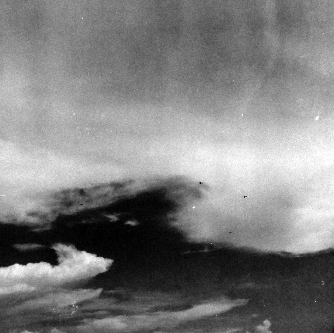 80-G-287528:   Battle off Samar, October 25, 1944.    Japanese fighters break formation to make suicide dives on carrier escorts on US Fleet during the Battle of Leyte Gulf.  As seen from USS Kitkun Bay (CVE-71).   Official U.S. Navy Photograph, now in the collection of the National Archives.    (2014/5/15). 