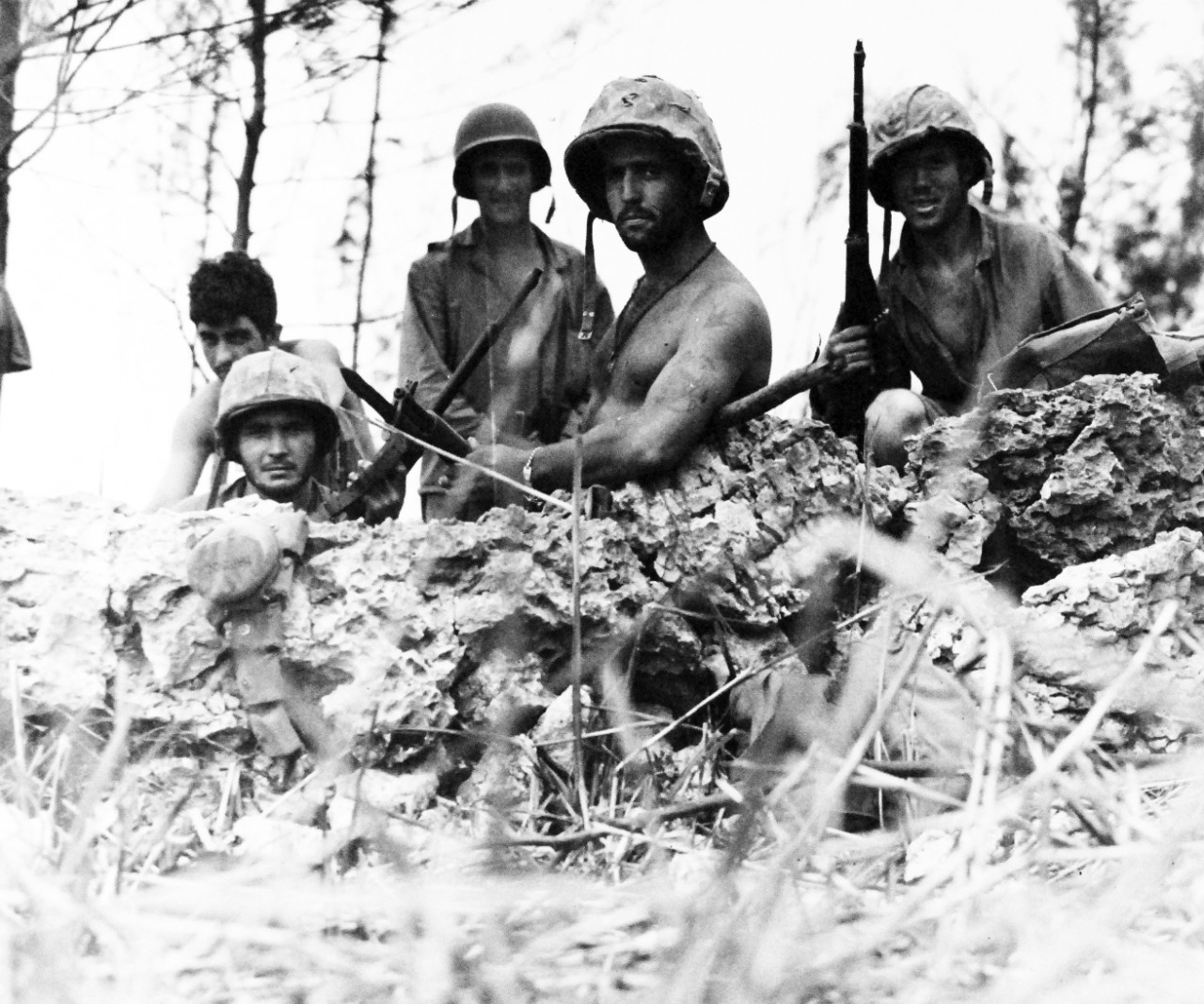 80-G-287156:   Invasion of Saipan, June-July 1944.   U.S. Marines in foxhole near front lines on Saipan July 1, 1944.   Photographed by USS Indianapolis (CA 35) photographer.   Official U.S. Navy photograph, now in the collections of the National Archives.  (2017/03/21).  