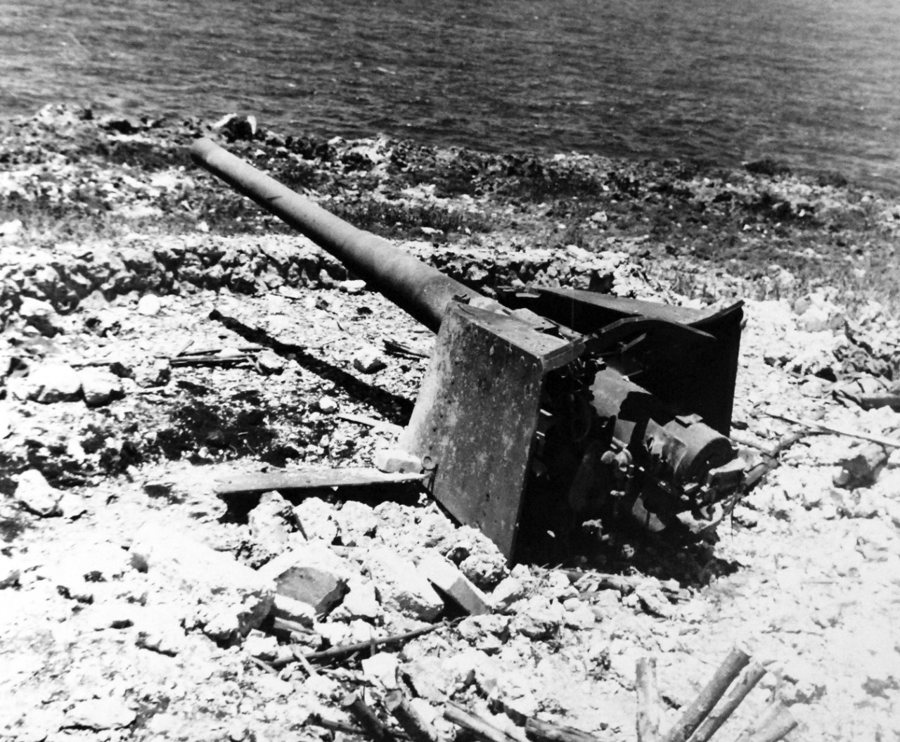 80-G-287162:   Invasion of Saipan, June-July 1944.     Enemy guns found on Saipan after its occupation by American forces, Nafutan Point, 6” gun, July 2, 1944.     Photographed by USS Indianapolis (CA 35) photographer.   Official U.S. Navy photograph, now in the collections of the National Archives.  (2017/03/21).  