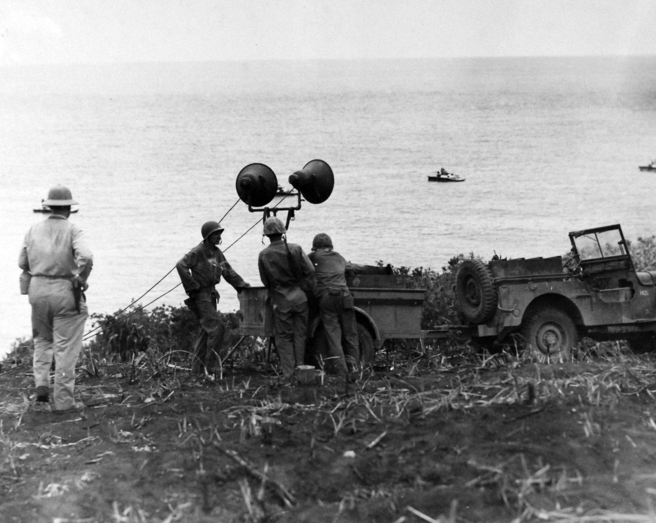 80-G-287232:   Invasion of Saipan, June-July 1944.  Loud speakers used to talk to Japanese snipers and civilians in caves near air strip on Saipan near Marpi Point to persuade them to surrender, 12 July.  Photographed by USS Indianapolis (CA-35) photographer.   Official U.S. Navy Photograph, now in the collections of the National Archives.  (2017/03/21).  