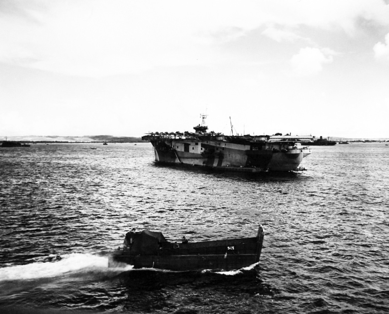 80-G-307714:  Invasion of Saipan, June-July 1944.  An LCT passing USS Rocky Mount (AGC-3) and a U.S. carrier loaded with Japanese planes off Saipan during the invasion, June 1944.      Official U.S. Navy Photograph, now in the collections of the U.S. Navy.  (2017/04/11).  