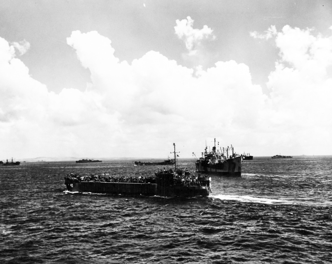 80-G-307729:  Invasion of Saipan, June-July 1944.  USS LST-40 in foreground and USS LST-483 in center.   Photograph received March 20, 1945.      Official U.S. Navy Photograph, now in the collections of the U.S. Navy.  (2017/04/11).  